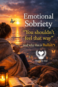 Woman wrapped in a blanket drinking coffee by the ocean at sunset with a dog and journal, overlaid text reads “Emotional Sobriety: You shouldn’t feel that way and why this is bullshit.”